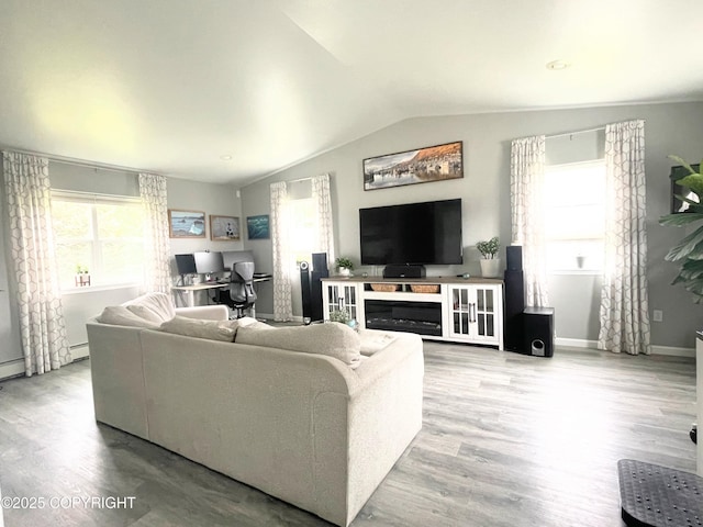 517 Sut Larsen Way, Kodiak, AK 99615 - living area with lofted ceiling, wood finished floors, baseboards, and baseboard heating
