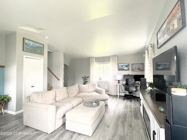 517 Sut Larsen Way, Kodiak, AK 99615 - living room featuring an office area, wood finished floors, stairway, and baseboards