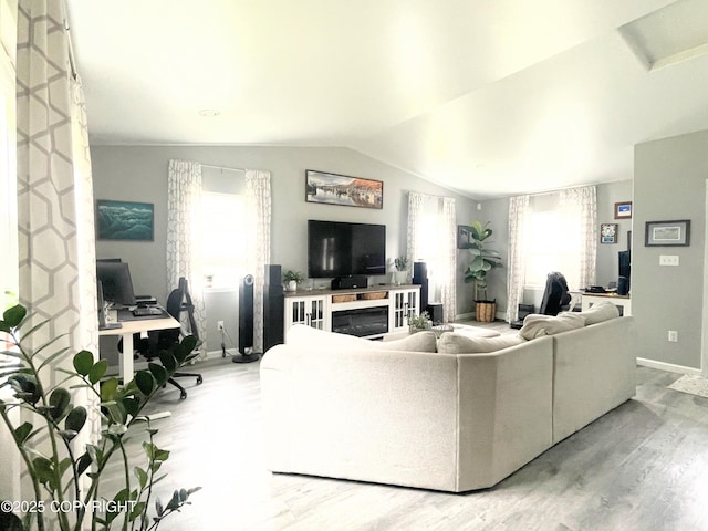 517 Sut Larsen Way, Kodiak, AK 99615 - living room featuring light wood-style floors, an office area, baseboards, and vaulted ceiling