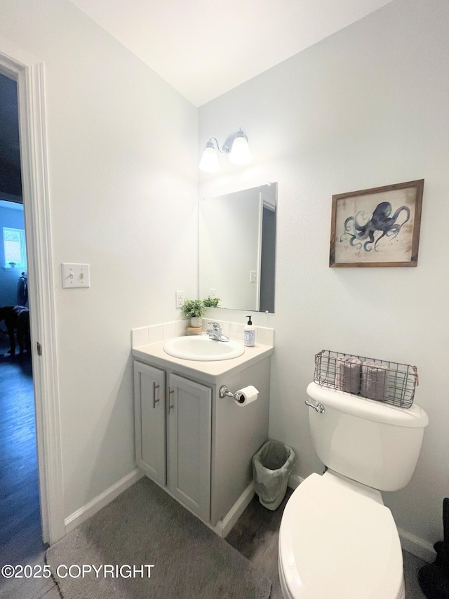 517 Sut Larsen Way, Kodiak, AK 99615 - half bathroom with vanity, toilet, and baseboards