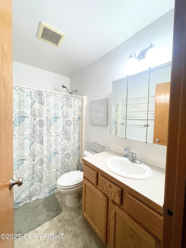 517 Sut Larsen Way, Kodiak, AK 99615 - bathroom with vanity, toilet, a shower with curtain, and tile patterned floors