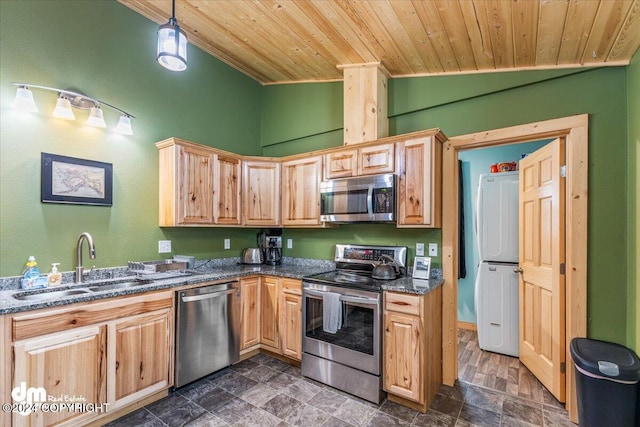 33773 Ruth Glacier Ave, Talkeetna, AK 99676 - kitchen with appliances with stainless steel finishes, stacked washer / dryer, a sink, wooden ceiling, and lofted ceiling