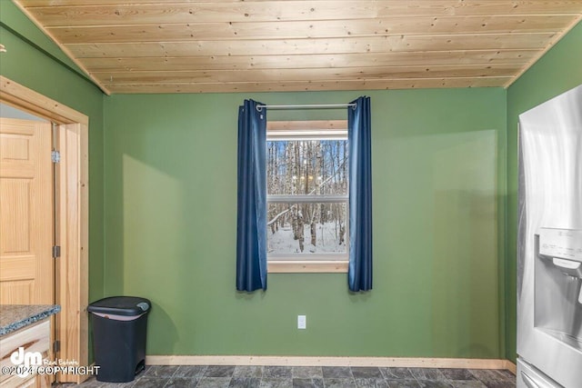 33773 Ruth Glacier Ave, Talkeetna, AK 99676 - empty room with baseboards, wooden ceiling, and stone finish flooring