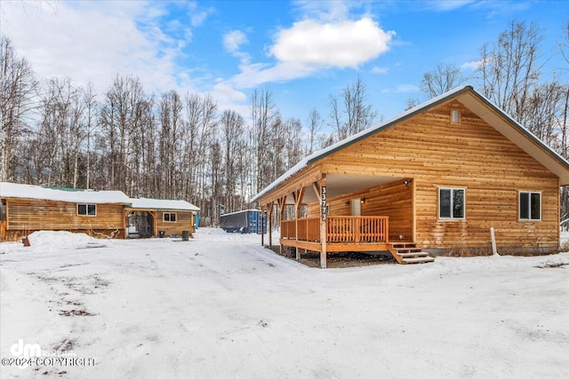 33773 Ruth Glacier Ave, Talkeetna, AK 99676 - snow covered house with a porch