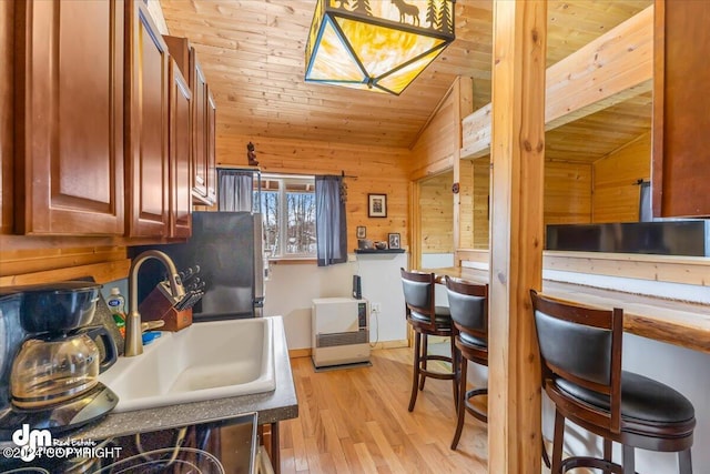 33773 Ruth Glacier Ave, Talkeetna, AK 99676 - kitchen featuring wooden ceiling, vaulted ceiling, a sink, light wood-style floors, and wood walls