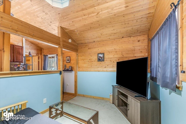 33773 Ruth Glacier Ave, Talkeetna, AK 99676 - carpeted living room featuring lofted ceiling, wood walls, baseboards, and wooden ceiling