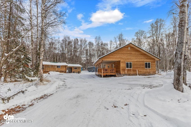 33773 Ruth Glacier Ave, Talkeetna, AK 99676 - snow covered back of property featuring a deck