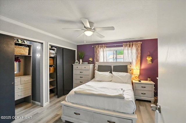 bedroom with wood finished floors, crown molding, ceiling fan, and a textured ceiling