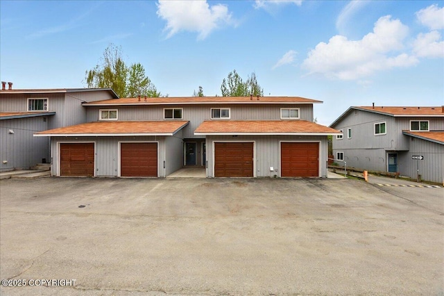 view of front of home featuring roof with shingles