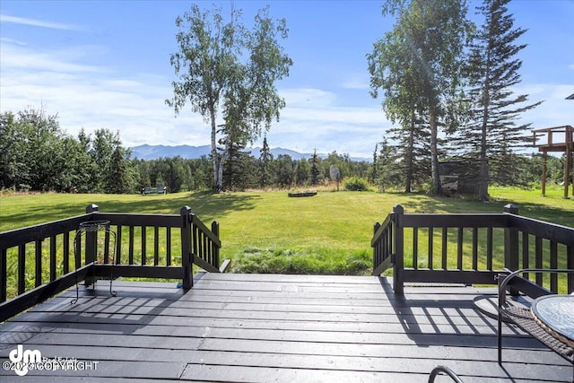 174 E Leota St, Wasilla, AK 99654 - wooden terrace with a mountain view and a yard