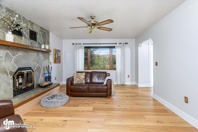 174 E Leota St, Wasilla, AK 99654 - living room with ceiling fan, wood finished floors, and baseboards