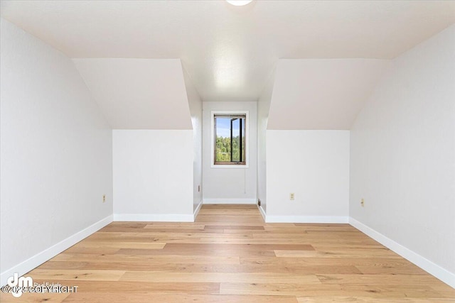 174 E Leota St, Wasilla, AK 99654 - bonus room with light wood finished floors, baseboards, and vaulted ceiling