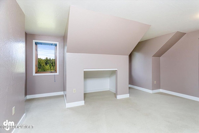 174 E Leota St, Wasilla, AK 99654 - bonus room featuring carpet floors, vaulted ceiling, and baseboards