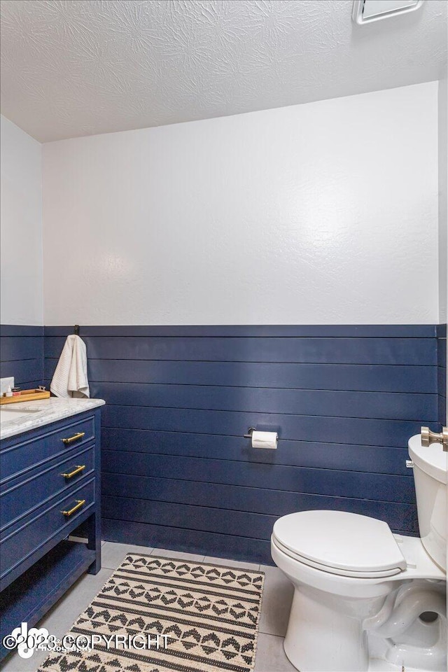174 E Leota St, Wasilla, AK 99654 - half bath featuring toilet, a wainscoted wall, and vanity