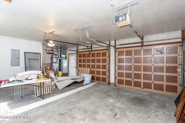 174 E Leota St, Wasilla, AK 99654 - garage with electric panel, gas water heater, and a garage door opener