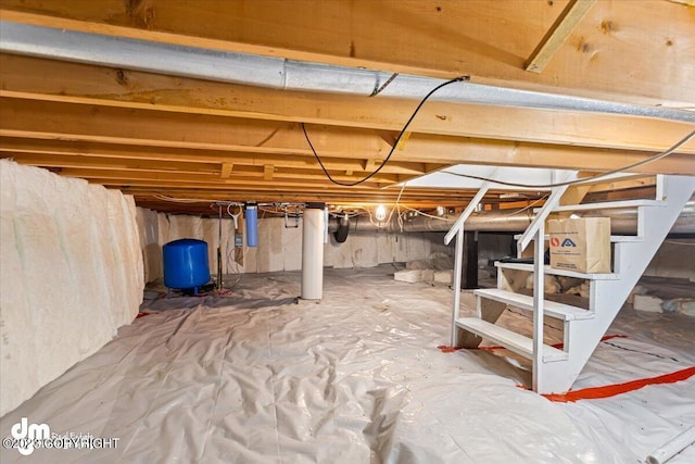 174 E Leota St, Wasilla, AK 99654 - unfinished below grade area with a water pressure tank and stairs