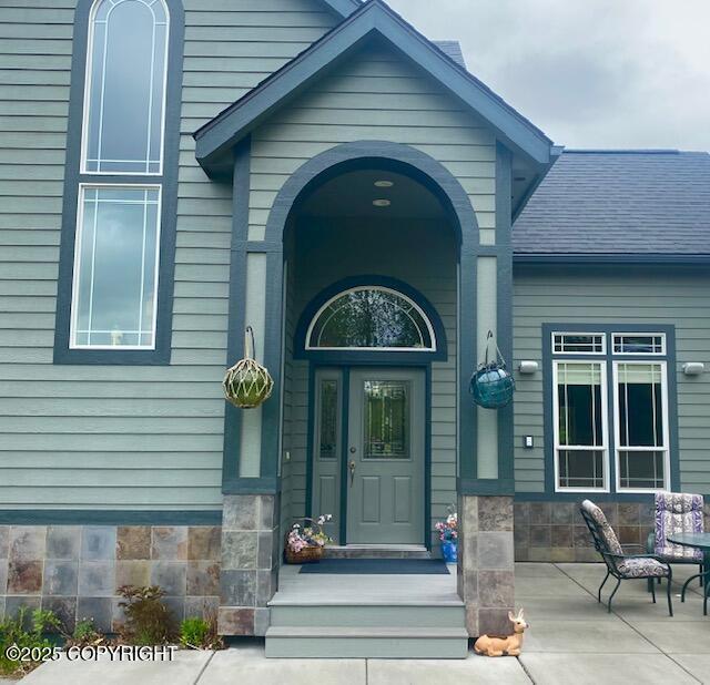 2295 N Filly Cir, Wasilla, AK 99654 - property entrance featuring roof with shingles