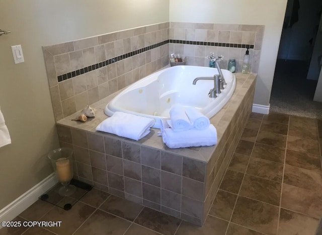 2295 N Filly Cir, Wasilla, AK 99654 - full bathroom featuring tile patterned flooring, baseboards, and a tub with jets