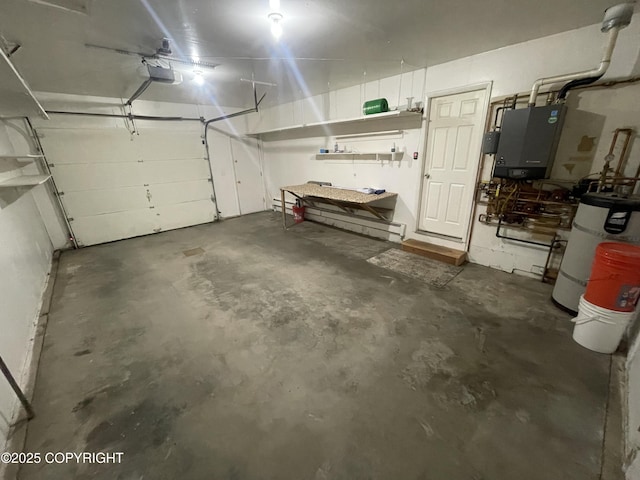 412 Pine Cir, Kenai, AK 99611 - garage with a garage door opener and strapped water heater