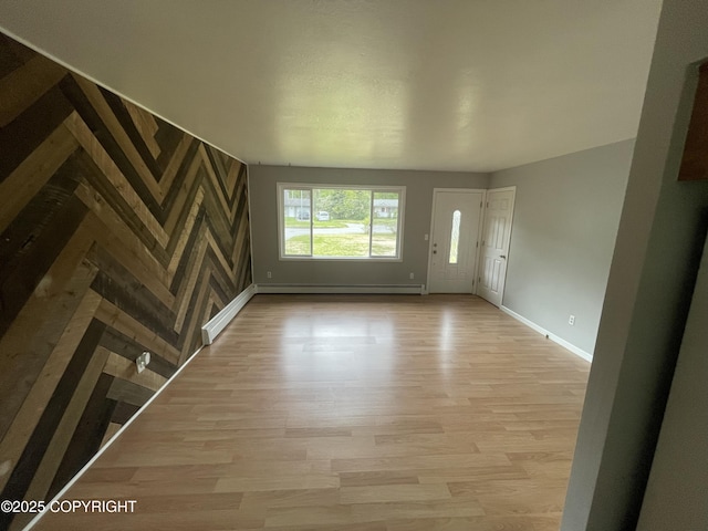 412 Pine Cir, Kenai, AK 99611 - foyer entrance with baseboards, baseboard heating, light wood-style flooring, and a baseboard heating unit