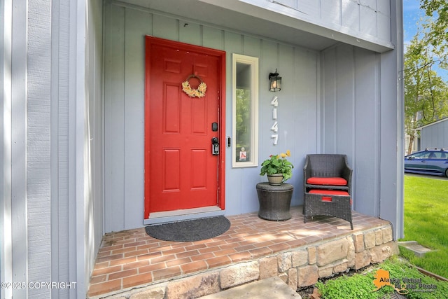 4147 Hampton Dr # 10D, Anchorage, AK 99504 - entrance to property with board and batten siding and covered porch