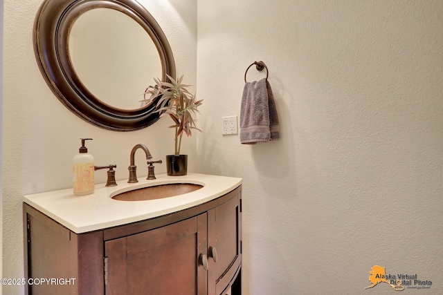 4147 Hampton Dr # 10D, Anchorage, AK 99504 - bathroom featuring vanity and a textured wall