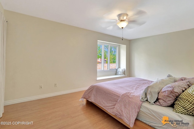 4147 Hampton Dr # 10D, Anchorage, AK 99504 - bedroom with light wood-style flooring, baseboards, and ceiling fan