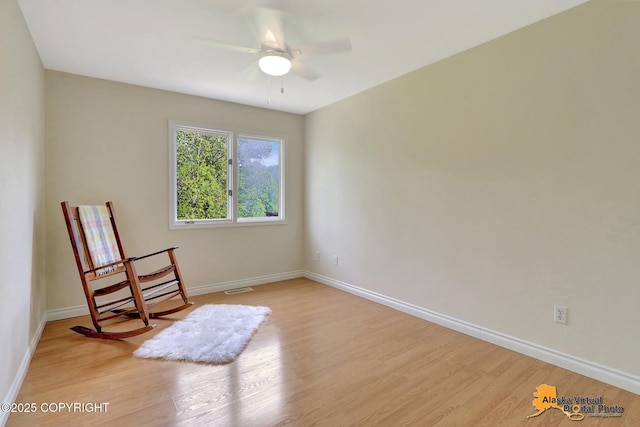 4147 Hampton Dr # 10D, Anchorage, AK 99504 - sitting room with light wood finished floors, baseboards, and ceiling fan