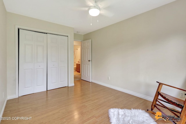 4147 Hampton Dr # 10D, Anchorage, AK 99504 - unfurnished bedroom featuring light wood-style flooring, baseboards, a closet, and ceiling fan