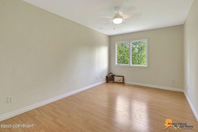 4147 Hampton Dr # 10D, Anchorage, AK 99504 - spare room featuring a ceiling fan, light wood-style flooring, and baseboards