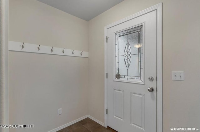 2370 Irontree Pl # 3, Anchorage, AK 99508 - doorway to outside featuring baseboards and dark tile patterned flooring