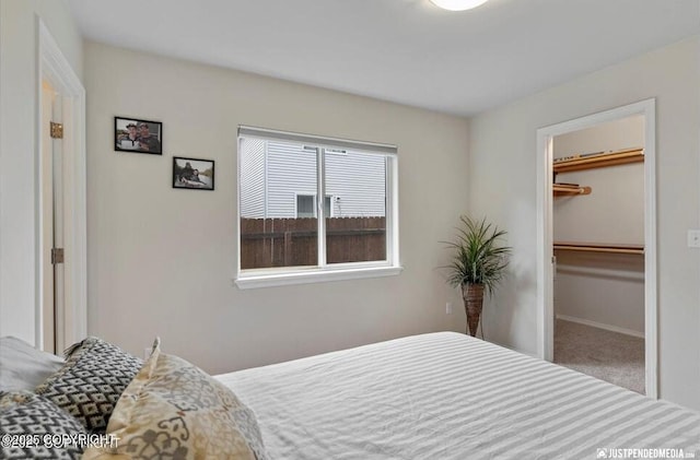 2370 Irontree Pl # 3, Anchorage, AK 99508 - carpeted bedroom with a spacious closet, a closet, and baseboards