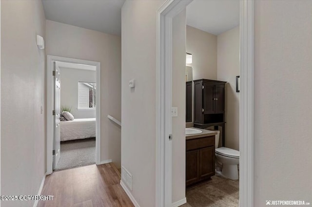 2370 Irontree Pl # 3, Anchorage, AK 99508 - hall featuring light wood-style floors and a sink