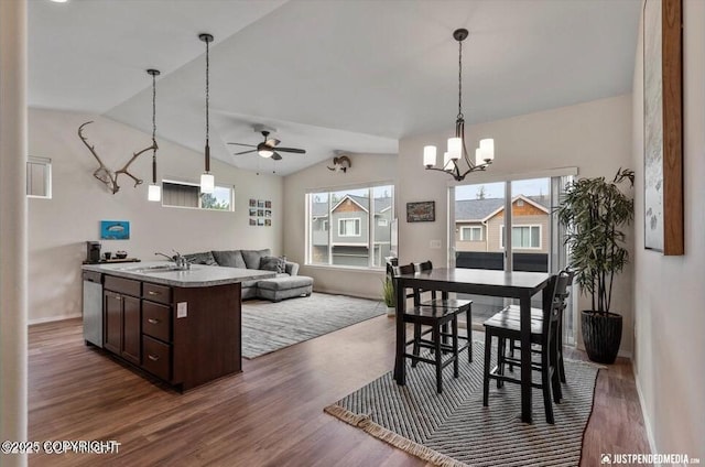 2370 Irontree Pl # 3, Anchorage, AK 99508 - dining area with plenty of natural light, vaulted ceiling, wood finished floors, a ceiling fan, and a chandelier