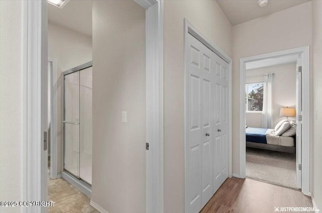 2370 Irontree Pl # 3, Anchorage, AK 99508 - corridor featuring baseboards and light wood-type flooring