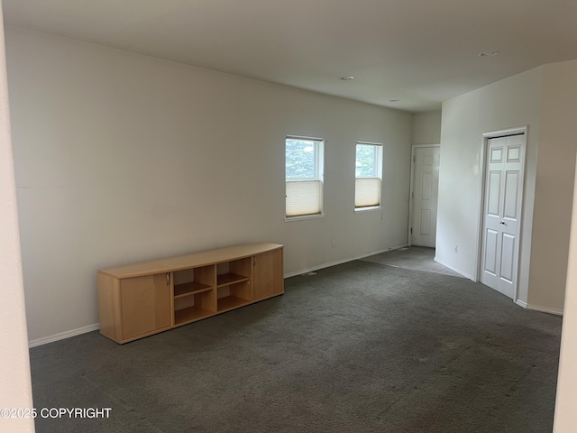 4766 Grumman St Unit 4766, Anchorage, AK 99507 - unfurnished bedroom featuring dark carpet, baseboards, and recessed lighting
