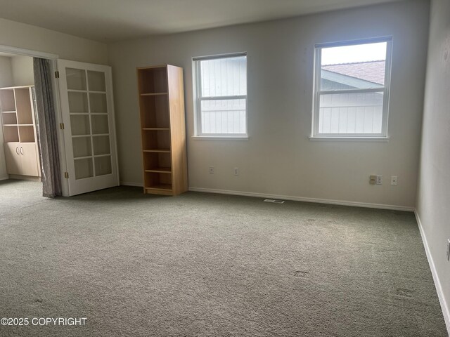 4766 Grumman St Unit 4766, Anchorage, AK 99507 - carpeted empty room featuring baseboards
