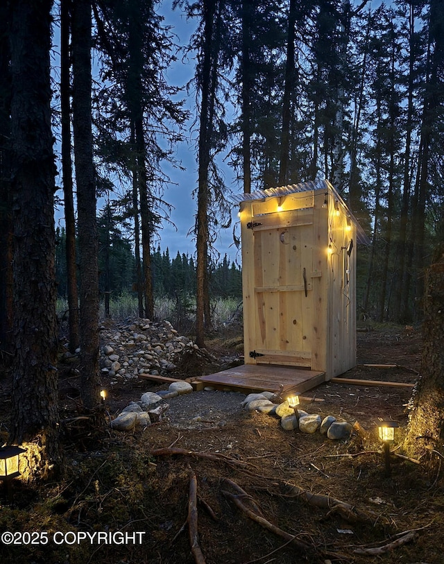 2246 S Fian Dr, Wasilla, AK 99654 - view of shed with a wooded view