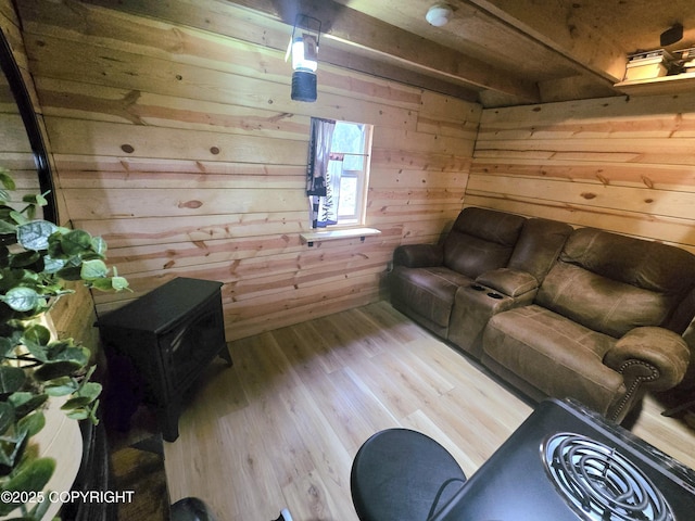 2246 S Fian Dr, Wasilla, AK 99654 - living room featuring a wood stove, wood walls, and wood finished floors