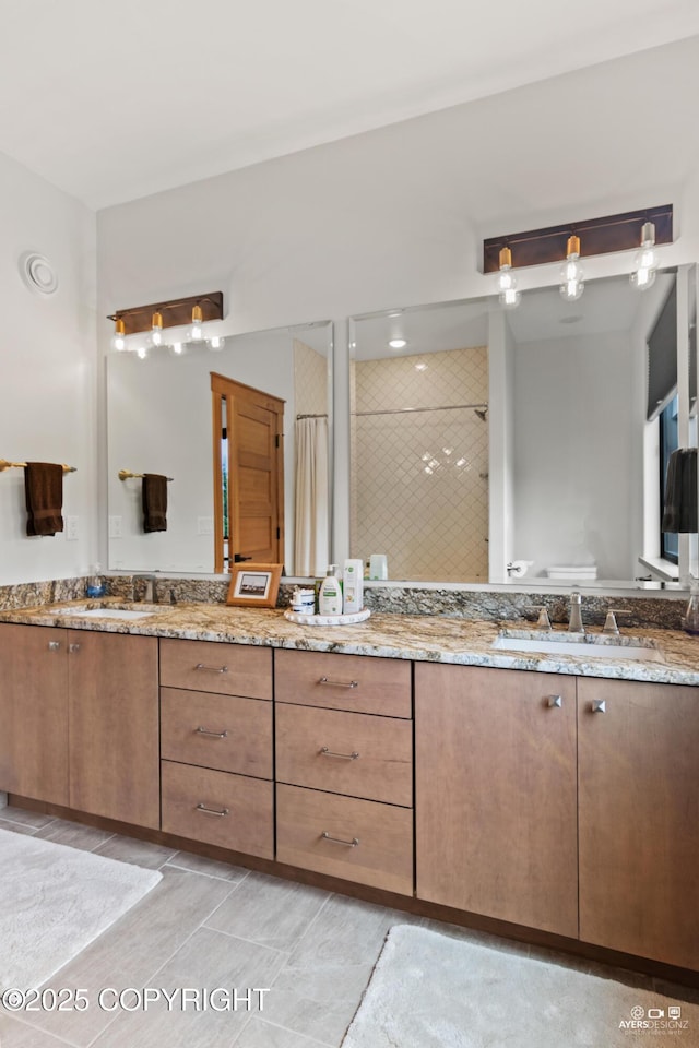 52619 Chumelina Ct, Kasilof, AK 99610 - full bathroom featuring double vanity and a tile shower