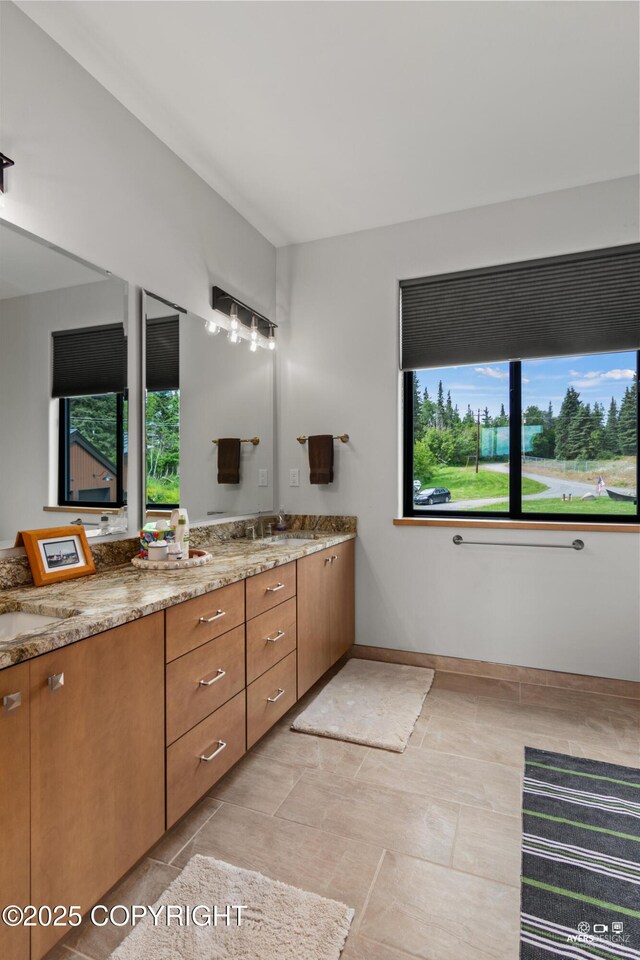 52619 Chumelina Ct, Kasilof, AK 99610 - bathroom with double vanity and baseboards