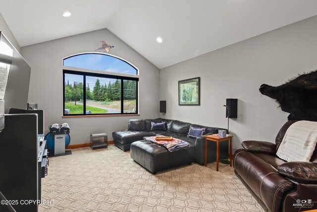 52619 Chumelina Ct, Kasilof, AK 99610 - living area with vaulted ceiling, healthy amount of natural light, recessed lighting, light colored carpet, and baseboards