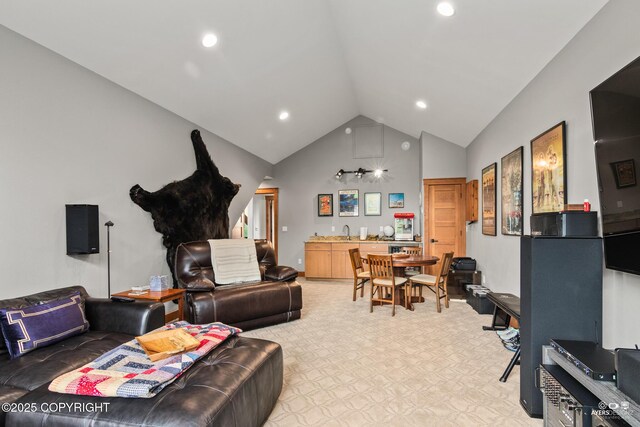 52619 Chumelina Ct, Kasilof, AK 99610 - living room featuring high vaulted ceiling, light carpet, recessed lighting, and bar