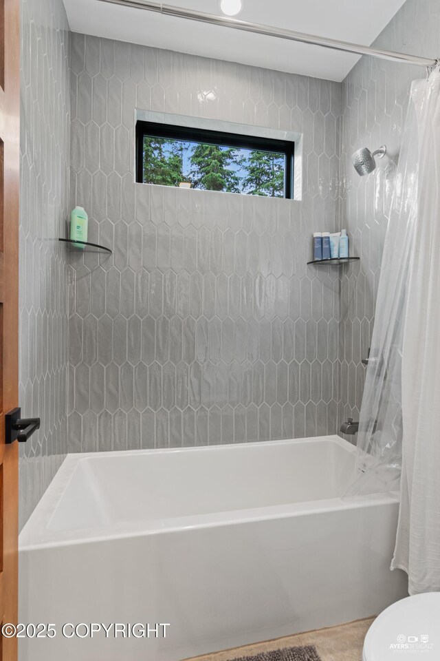 52619 Chumelina Ct, Kasilof, AK 99610 - bathroom featuring shower / bathtub combination with curtain, toilet, and wood finished floors