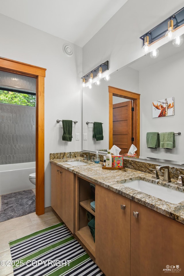 52619 Chumelina Ct, Kasilof, AK 99610 - bathroom with double vanity, toilet, and tile patterned flooring