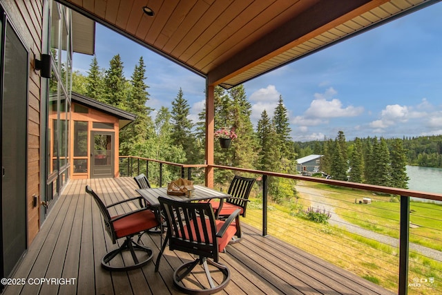52619 Chumelina Ct, Kasilof, AK 99610 - deck featuring outdoor dining space, a sunroom, and a water view