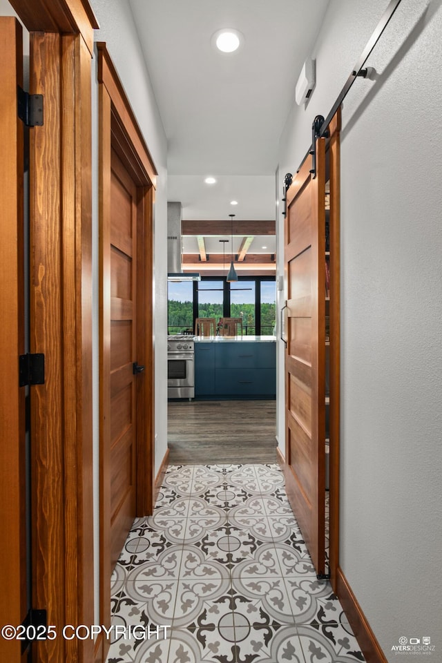 52619 Chumelina Ct, Kasilof, AK 99610 - hallway with a barn door, recessed lighting, baseboards, and light wood-style flooring