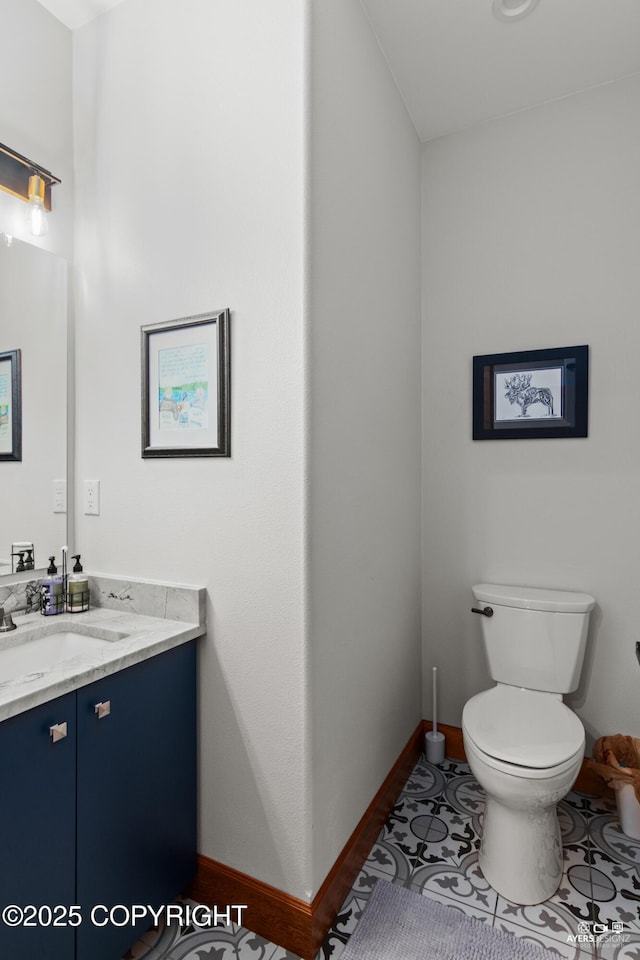 52619 Chumelina Ct, Kasilof, AK 99610 - bathroom with vanity, toilet, and baseboards