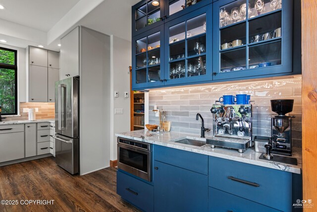 52619 Chumelina Ct, Kasilof, AK 99610 - indoor wet bar with high quality fridge, backsplash, dark wood-type flooring, and recessed lighting