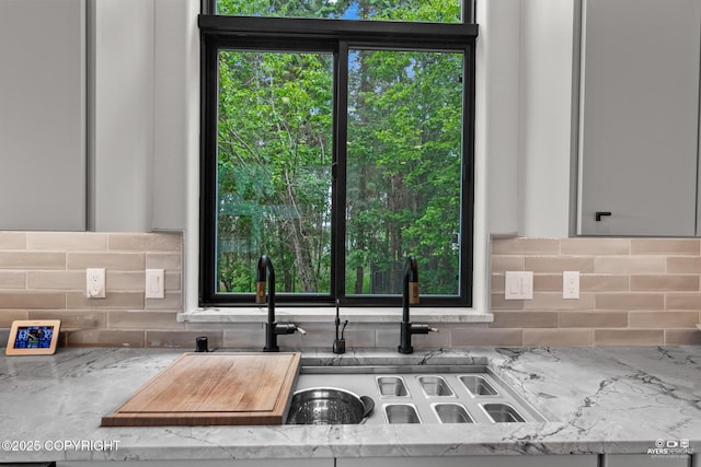 52619 Chumelina Ct, Kasilof, AK 99610 - kitchen with tasteful backsplash and light stone counters